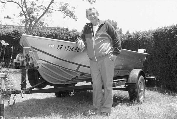 Photo of Neil Kelly with one of his Baja fishing "tin boats."
