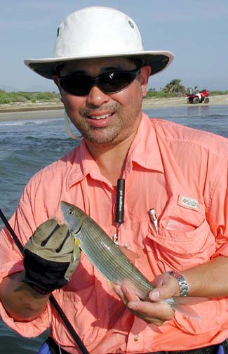 Photo of Thomas Pak with bonefish caught on fly tackle at East Cape, Mexico.