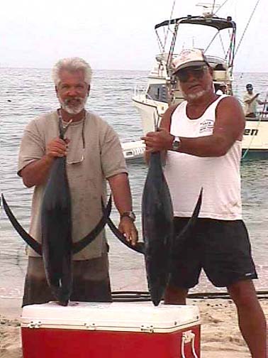 Photo of Mark Rayor and Don Oser with albacore tuna caught at East Cape, Baja California Sur, Mexico.