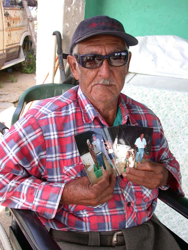 Photo of Jesus Projeres with photos of totoaba caught at East Cape, Baja California Sur, Mexico.