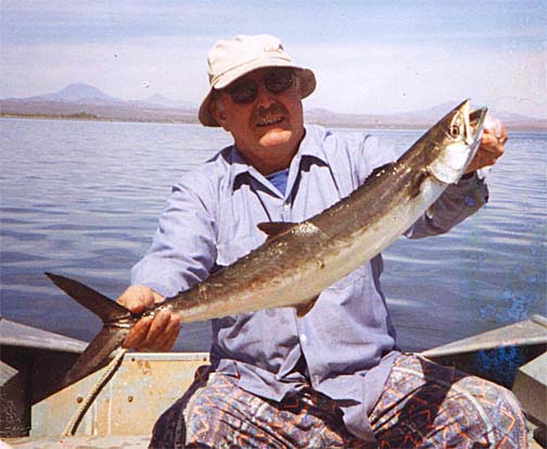 Photo of Jim Mori with a Monterey Spanish Mackerel caught in the Sea of Cortez, Mexico.